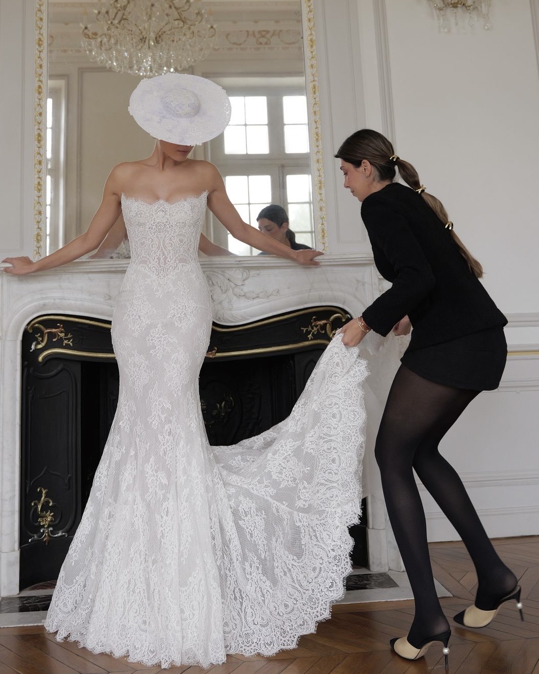 Lee Petra Grebenau fitting a couture lace bridal gown at her atelier
