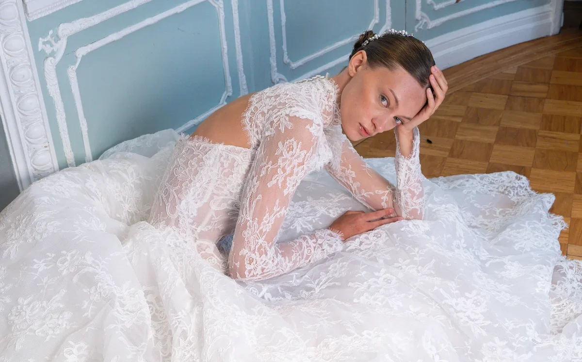 Lee Petra Grebenau bride in a long-sleeve lace gown from the Salon Privé Spring/Summer 2027 collection